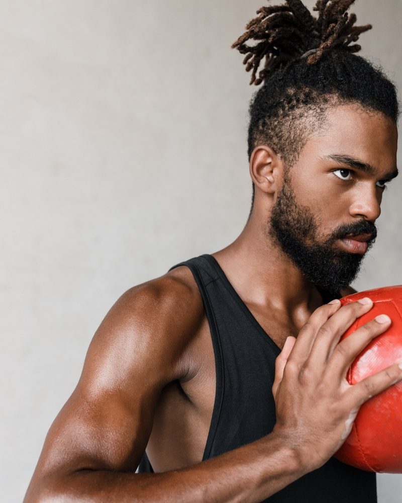 image-of-african-american-sportsman-working-out-wi-QDGDA53.jpg